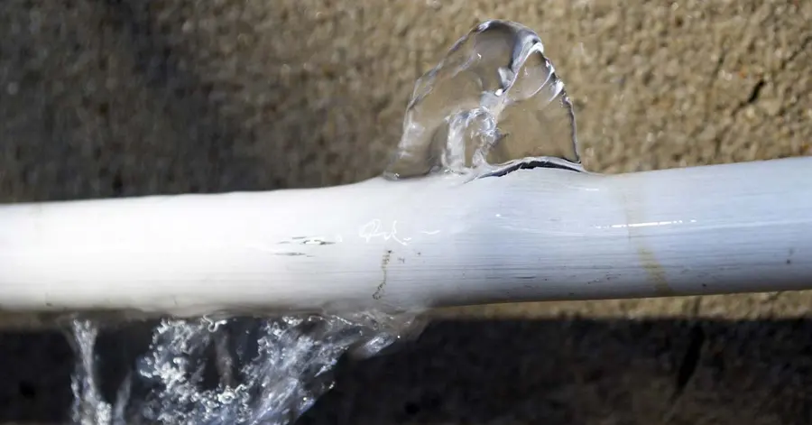 Water spraying from a failed appliance supply line in a Big Lake, MN home