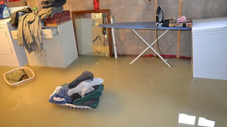Flooded Big Lake, MN basement with belongings floating in the water